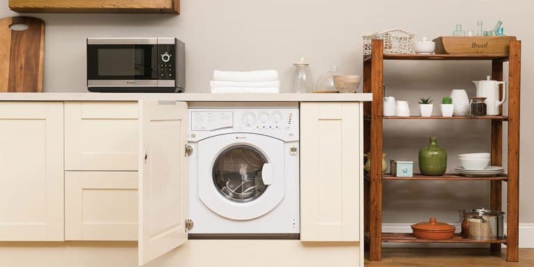 washing machine in a kitchen cabinet 