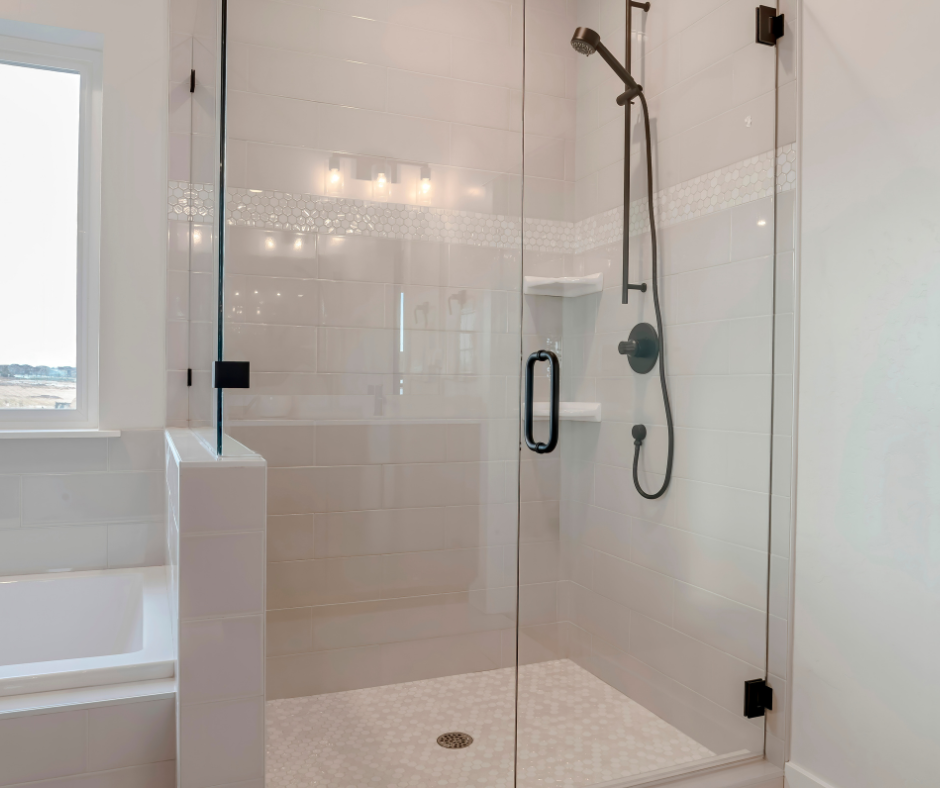 A 30" wide shower stall with a shower valve and drain