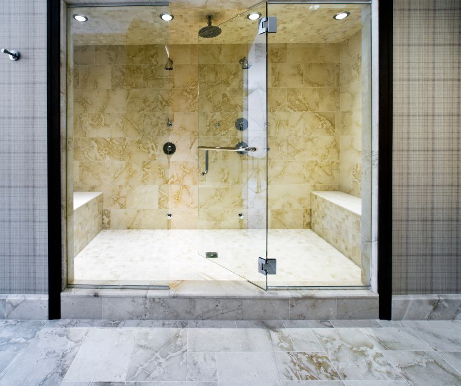 A custom shower with a shower head and a shower bench