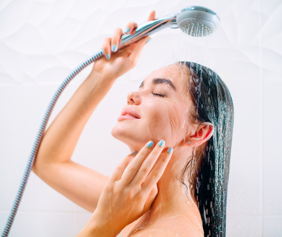A person holding an Oxygenics shower head