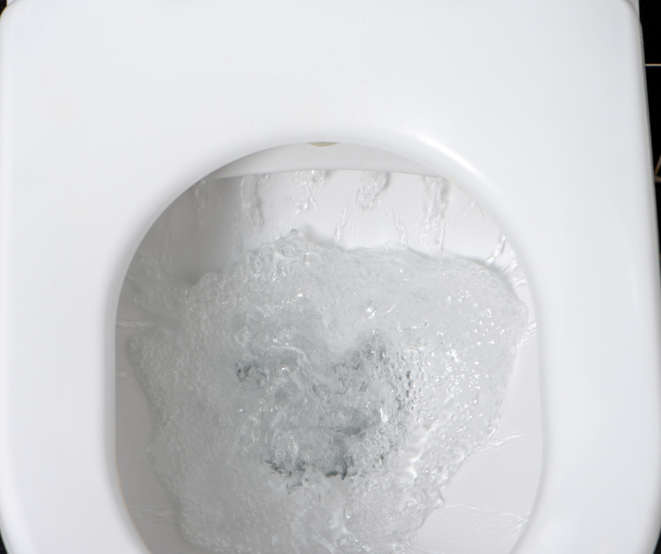 An image showing a toilet bowl with bubbles, indicating the problem of toilet blowing bubbles and the need for identifying the root cause.