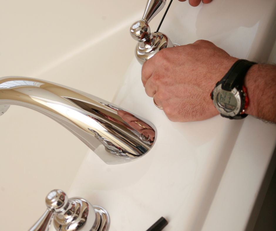 A person reattaching a faucet handle to a double handle faucet