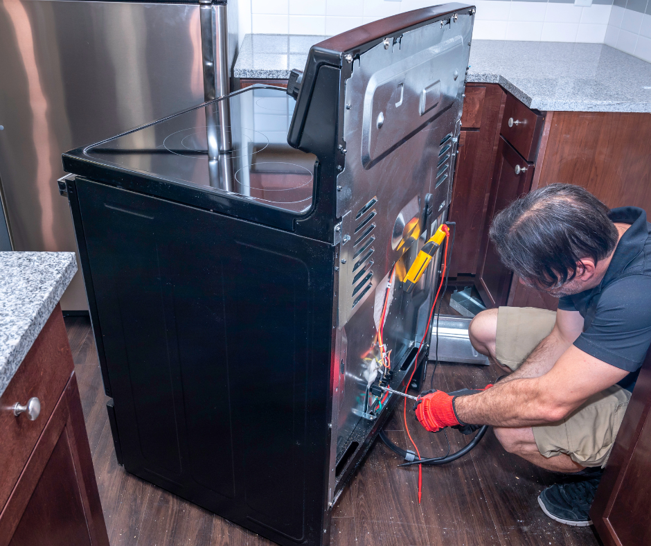A person troubleshooting an ice maker