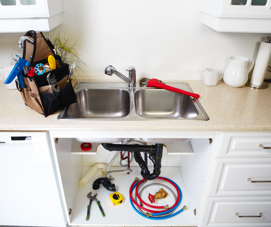 A selection of tools and materials needed to repair a Moen kitchen faucet