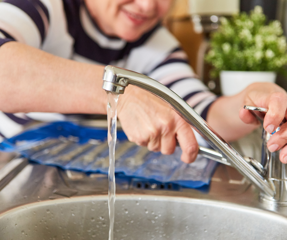 Step-by-step guide to replacing a faucet kitchen, with an image of a person removing an old faucet from a sink.